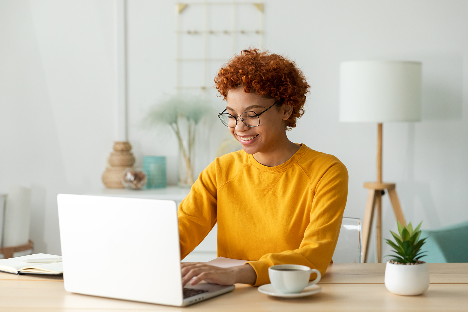 young-woman-using-laptop-home